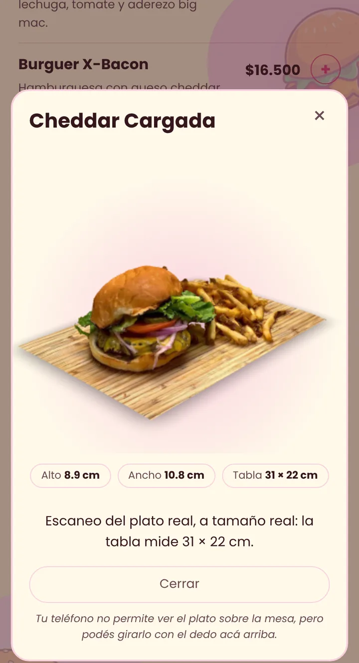 Celular mostrando una hamburguesa en 3D con sus medidas reales.